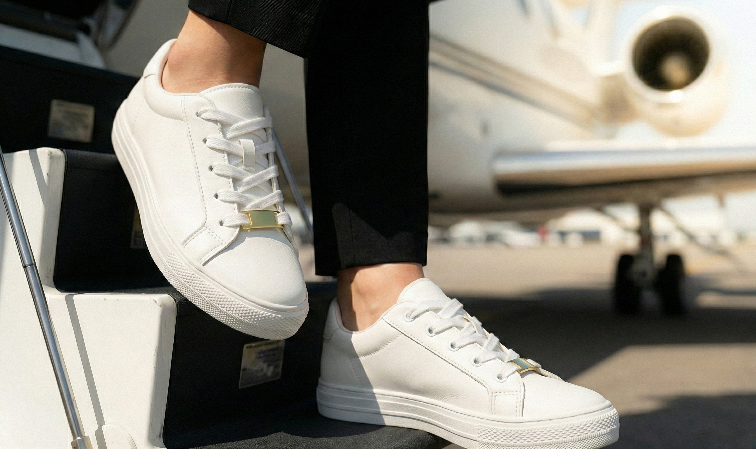 First class scene with shoe charms and airplane